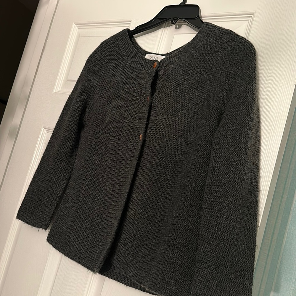 Dark cardigan light sweater